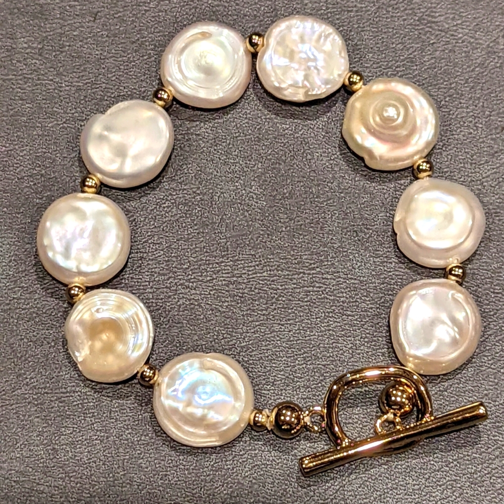 Coin shaped fresh water cultured pearl bracelet set in gold plated silver
